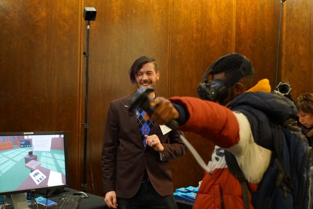 Attendee at 2020 ED Games Expo, a showcase of government-supported educational learning games and technologies, explores an early Courtroom 600 proof-of-concept.